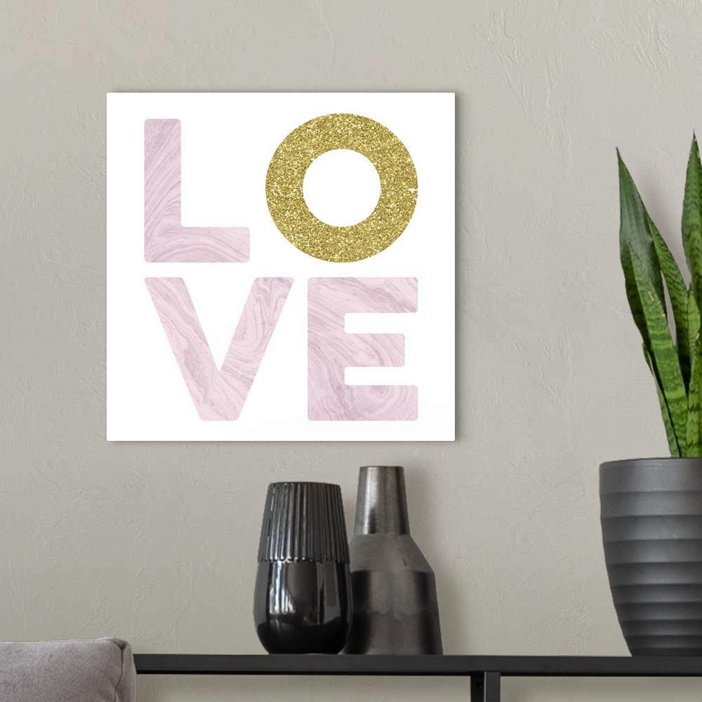 A modern room featuring LOVE spelled out in white marble and glitter gold on a white square background with a glitter gol...