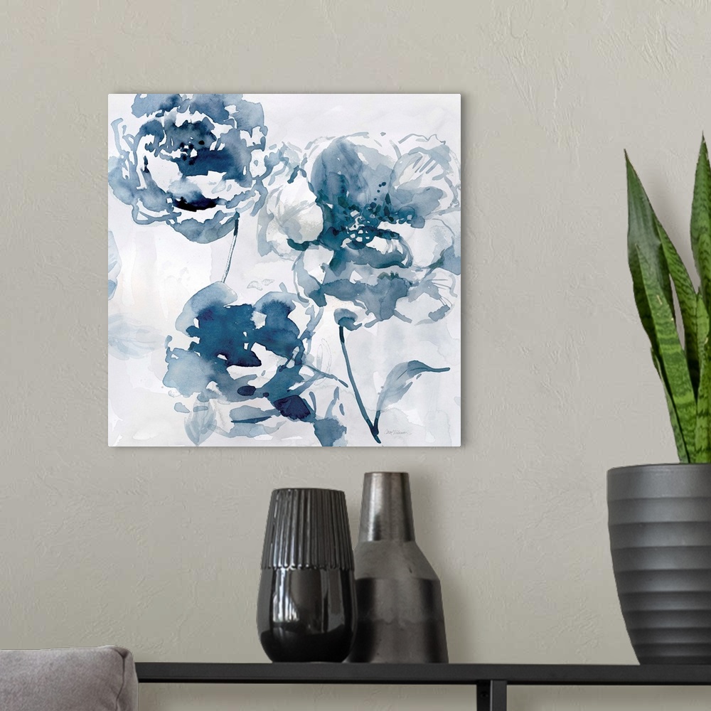 A modern room featuring A square abstract watercolor painting of blue flowers.