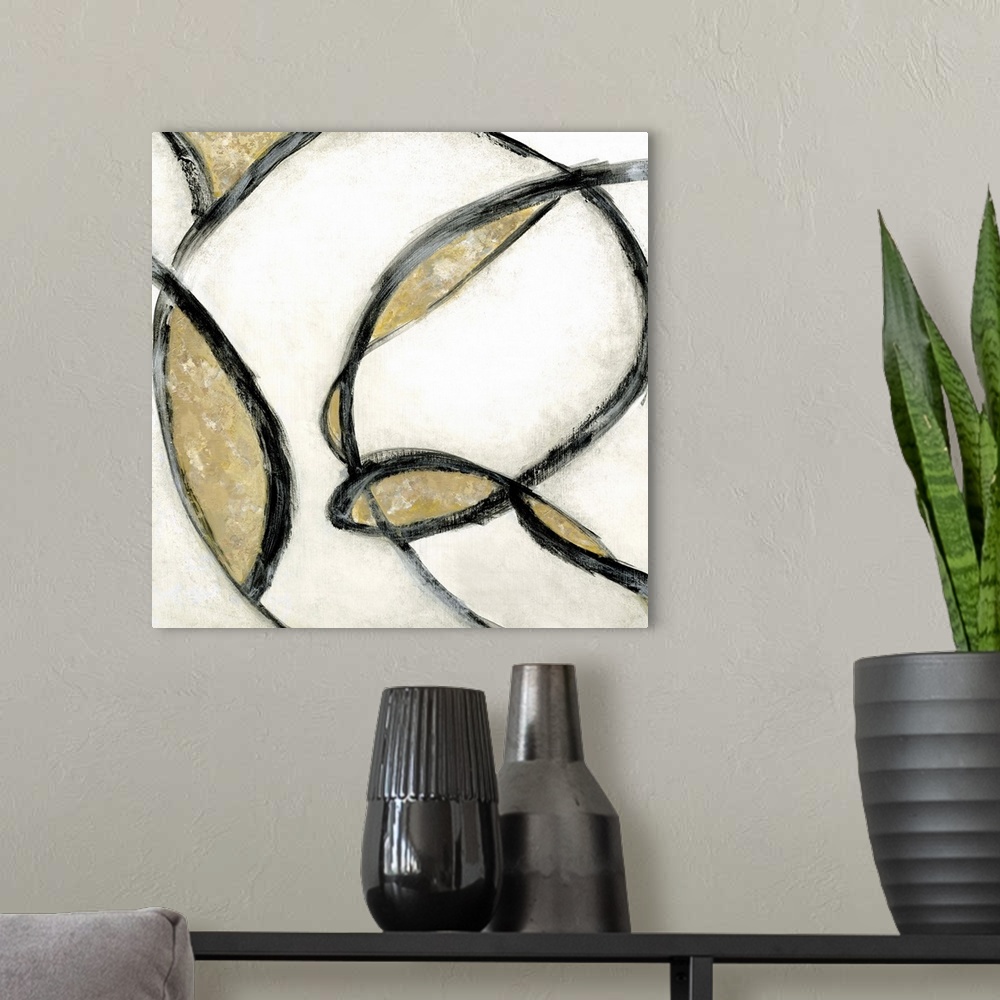 A modern room featuring Abstract contemporary painting in swirling black strokes with gold and beige.