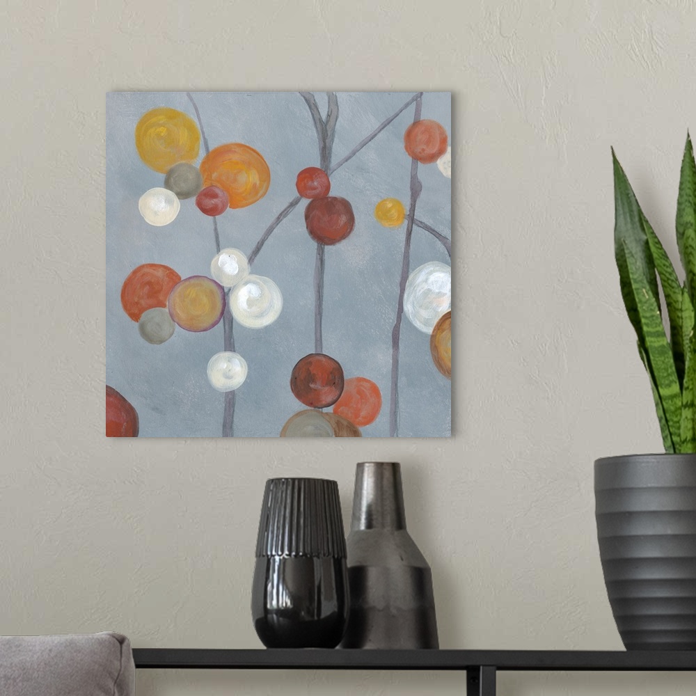 A modern room featuring Square abstract painting with a slate blue background and circles in orange, white, gray, yellow,...