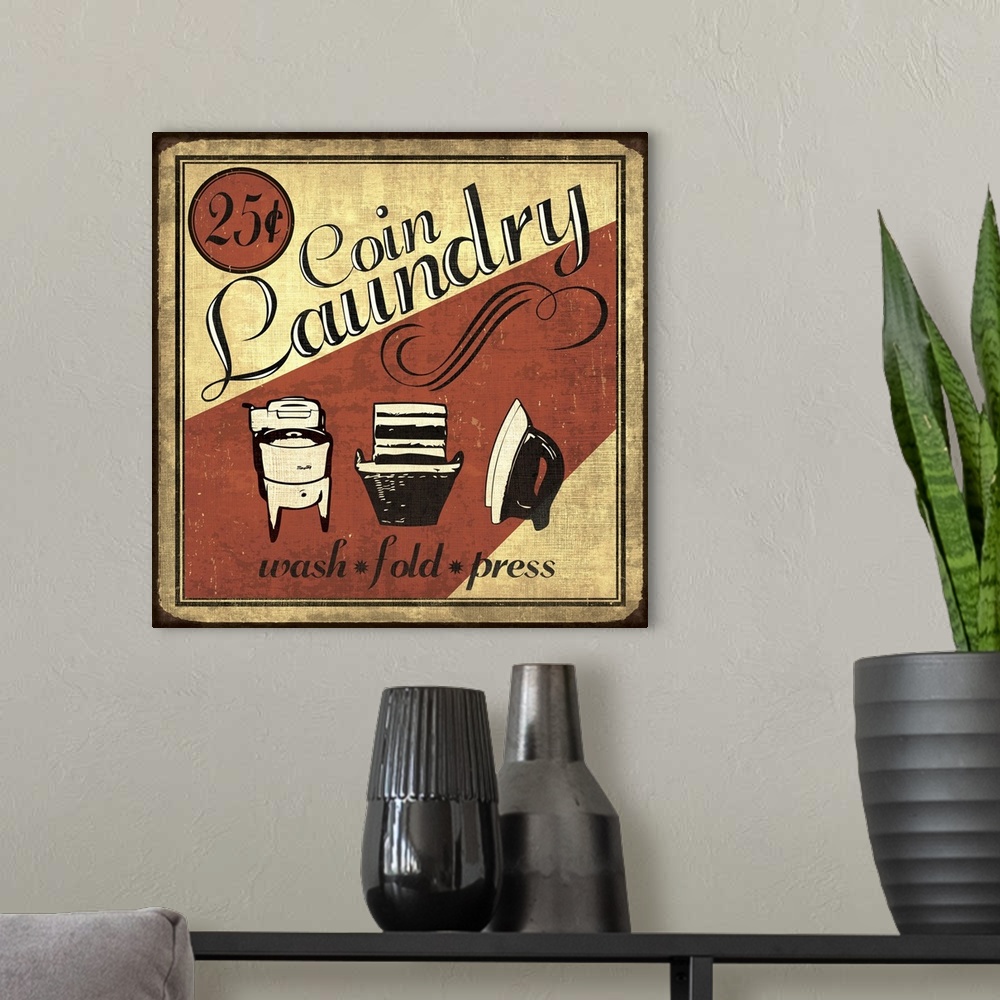 A modern room featuring Vintage coin laundry sign in red, black, and cream.