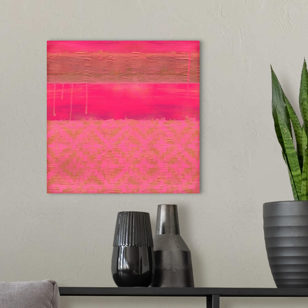 A modern room featuring Abstract color block art in pink and gold.