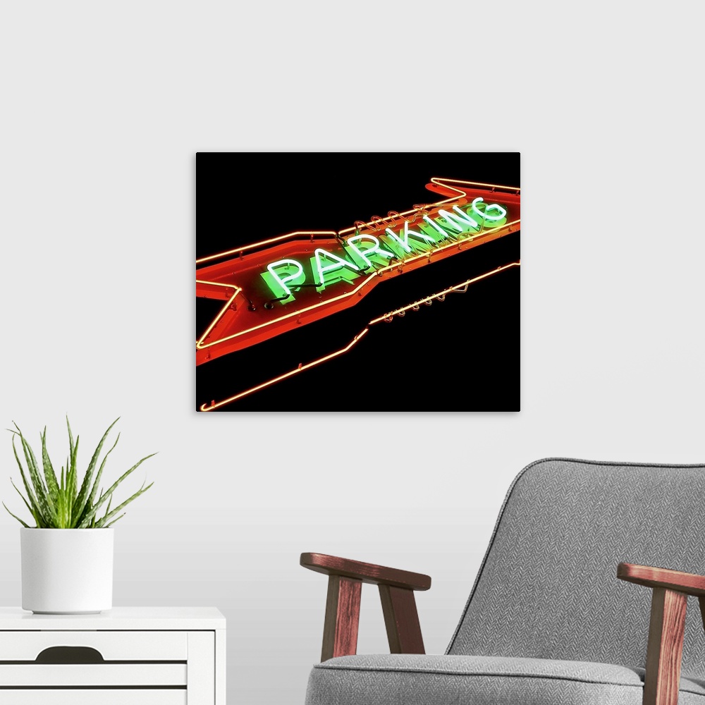 A modern room featuring Photograph of a red and green neon arrow sign lit up at night that reads "Parking"