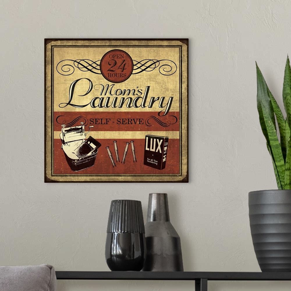 A modern room featuring Vintage "Mom's Laundry" sign in red, black, and cream.