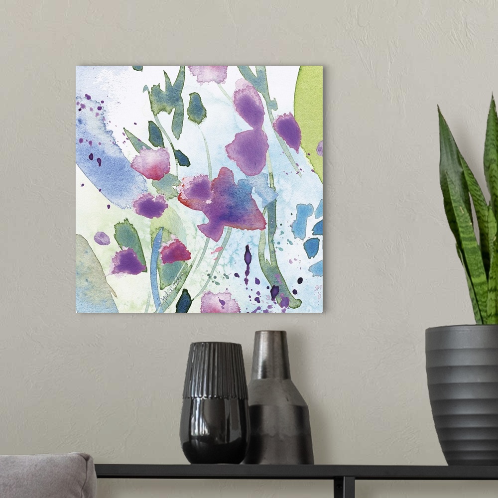A modern room featuring Square abstract floral watercolor painting in cool tones of blue, green, and purple.