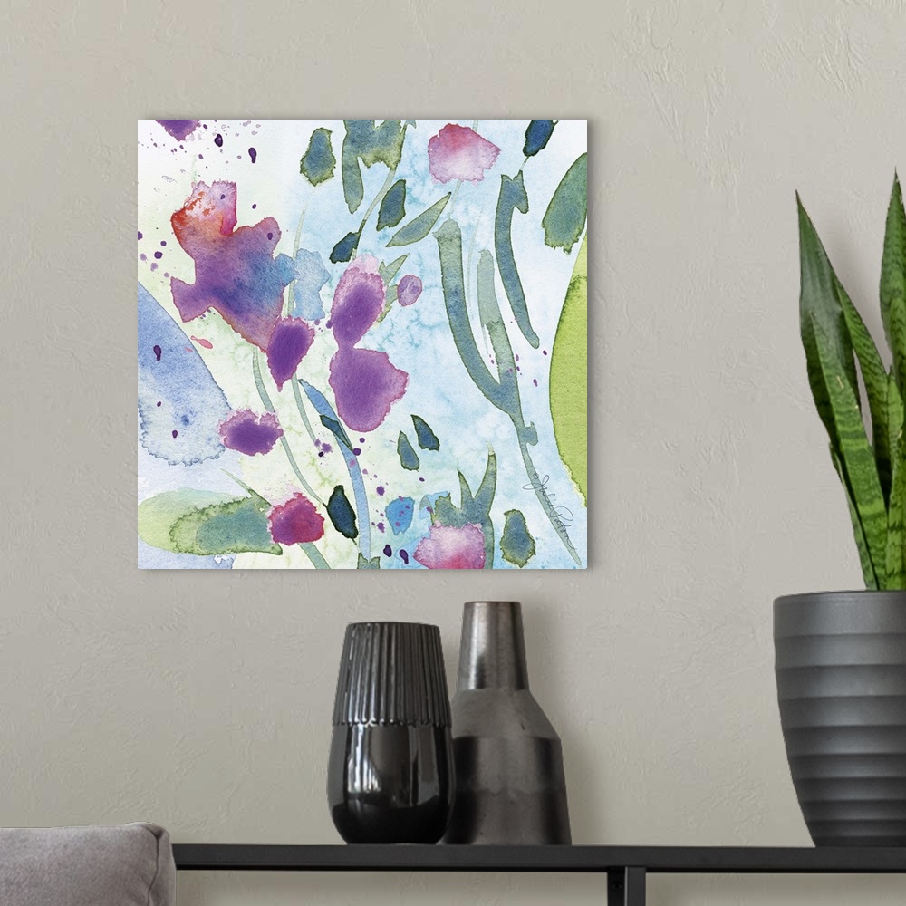 A modern room featuring Square abstract floral watercolor painting in cool tones of blue, green, and purple.