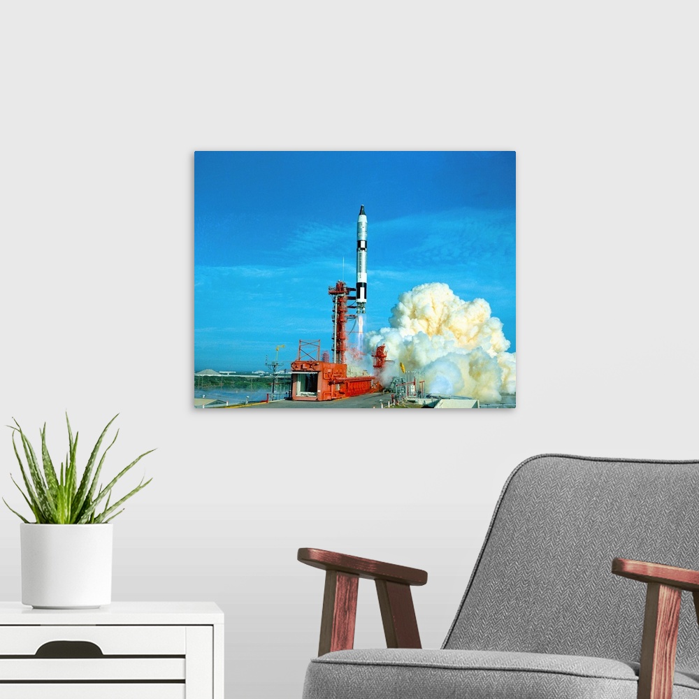 A modern room featuring Cape Kennedy, Florida....A little puff of reddish-brown smoke drifts away (left), signaling the e...