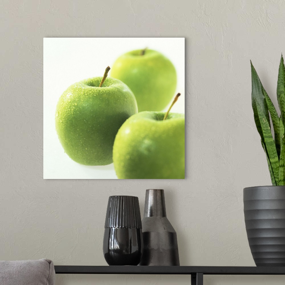 A modern room featuring Close-up of an array of green apples