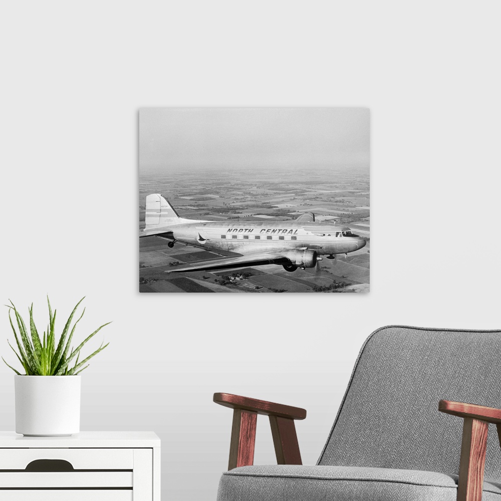 A modern room featuring A Douglas DC-3 of North Central Airlines in flight.
