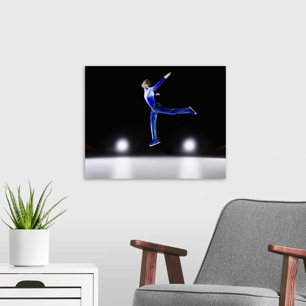 A modern room featuring Man performing, Ice skating jump.