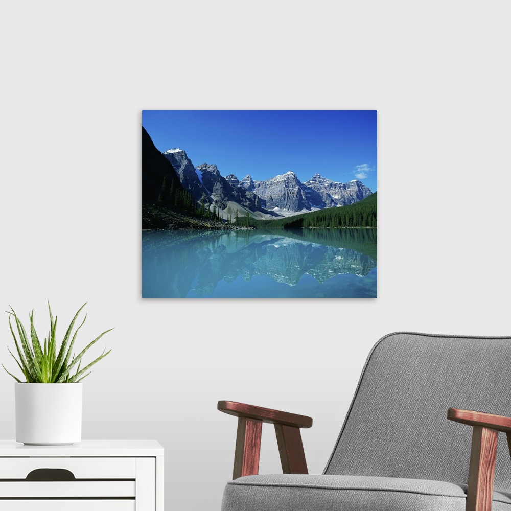 A modern room featuring Moraine Lake and mountains, Banff
