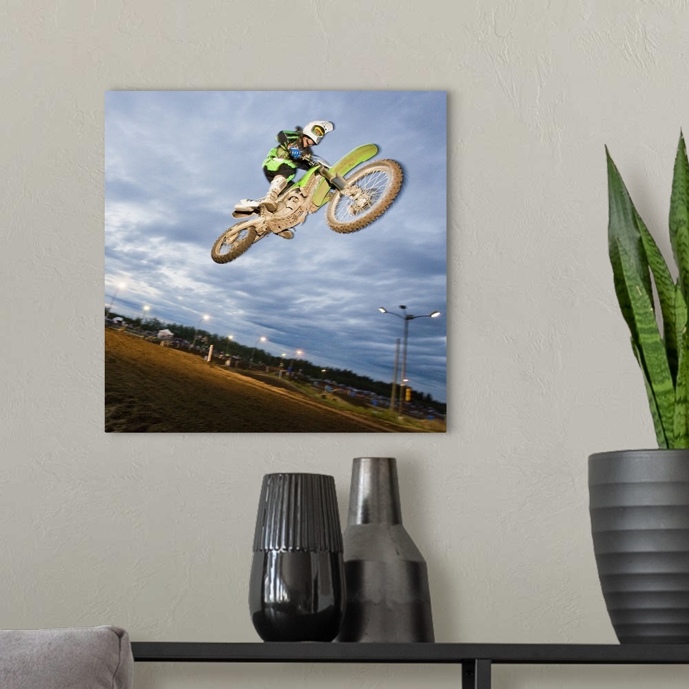 A modern room featuring Motorcross rider jumping on track