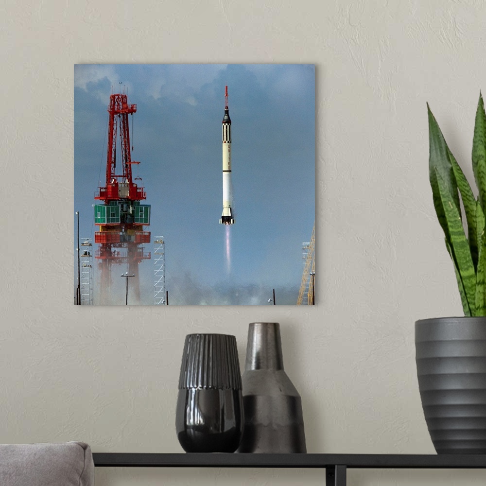 A modern room featuring Cape Canaveral, FLA.: Redstone rocket blasts off with Mercury capsule carrying Commander Shepard ...