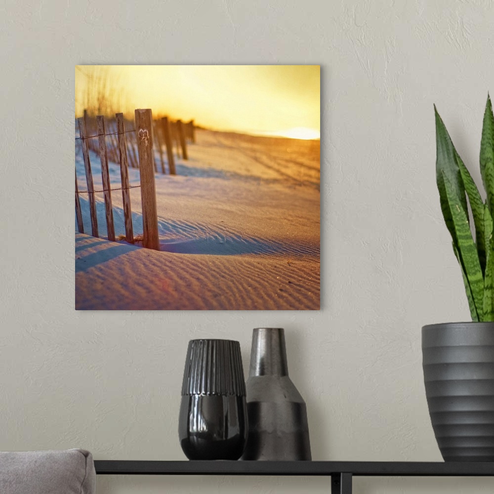 A modern room featuring Undulating sand dunes, rippled sand long shadows, beach fence with carved heart and sunrise over ...