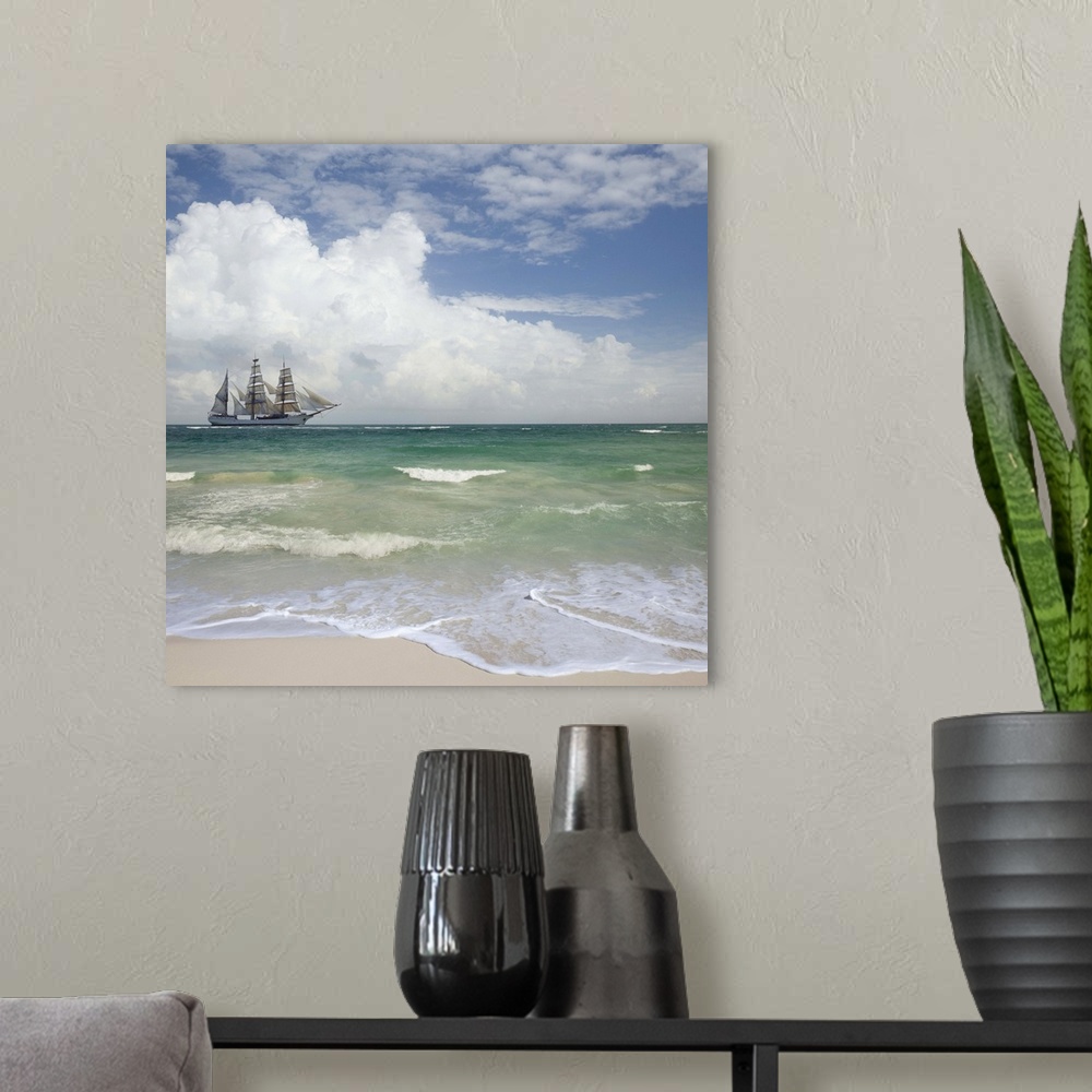 A modern room featuring A tall ship sails off shore from a beautiful tropical beach.