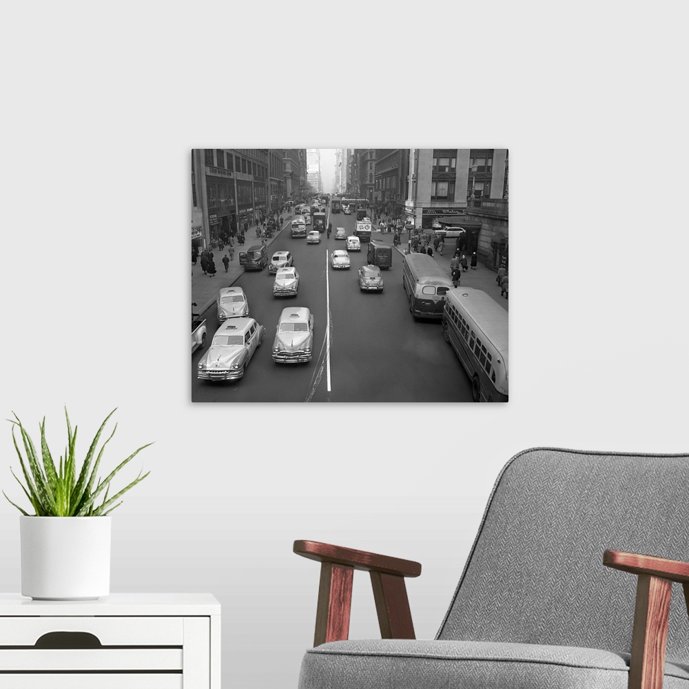 A modern room featuring Photo shows 42nd St. looking west showing traffic and people at about 9am.