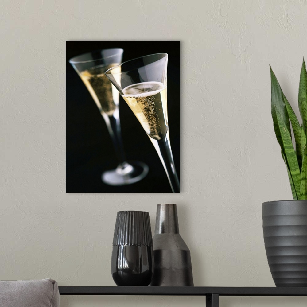 A modern room featuring Two Glasses Of Champagne