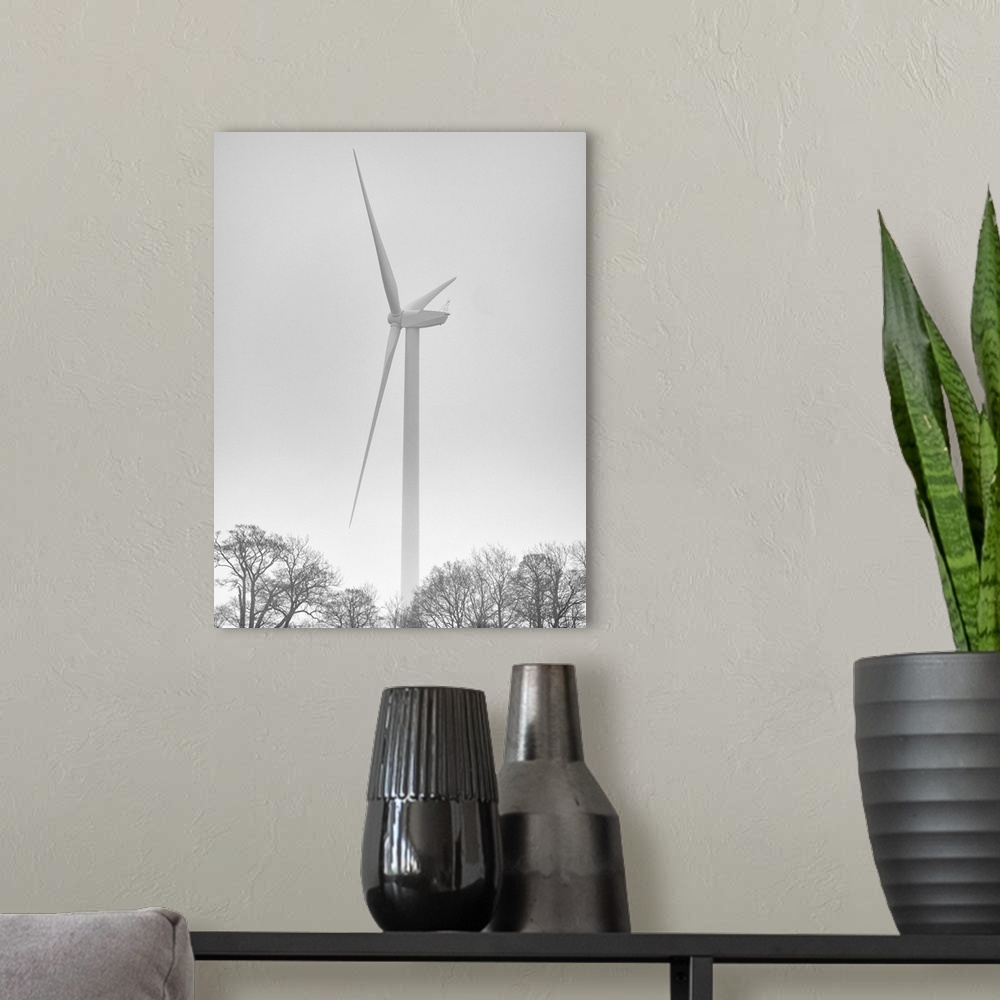 A modern room featuring England, Northumberland, Plessey Woods Country Park. Wind Turbine on a foggy day, located alongsi...
