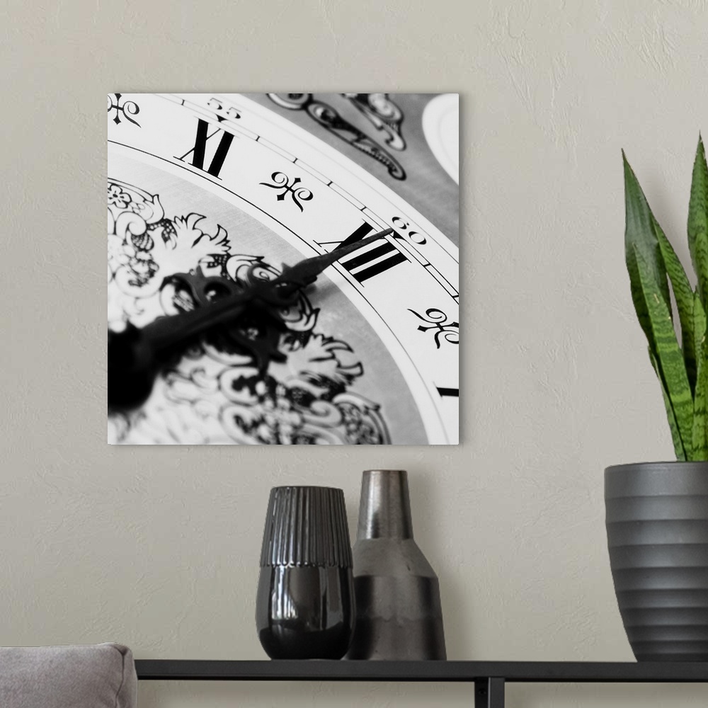 A modern room featuring Old clock face showing the time. Midnight time on the clock.