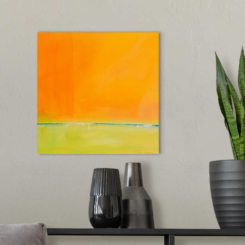 A modern room featuring Contemporary abstract painting in bright orange and yellow-green.