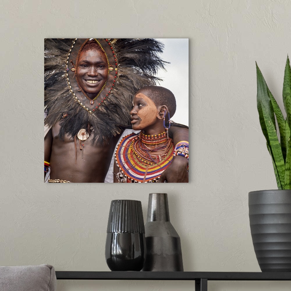 A modern room featuring Kenya, Kilgoris County, Oloololo. A Maasai warrior and his girlfriend during an eunoto ceremony.