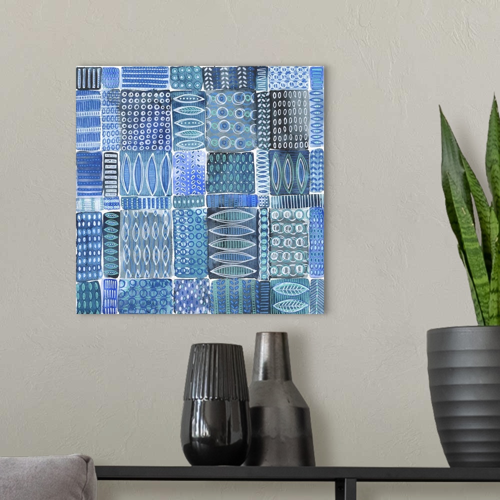 A modern room featuring Abstract batik patterns in shades of indigo, cobalt, teal and gray, Shibori inspired.