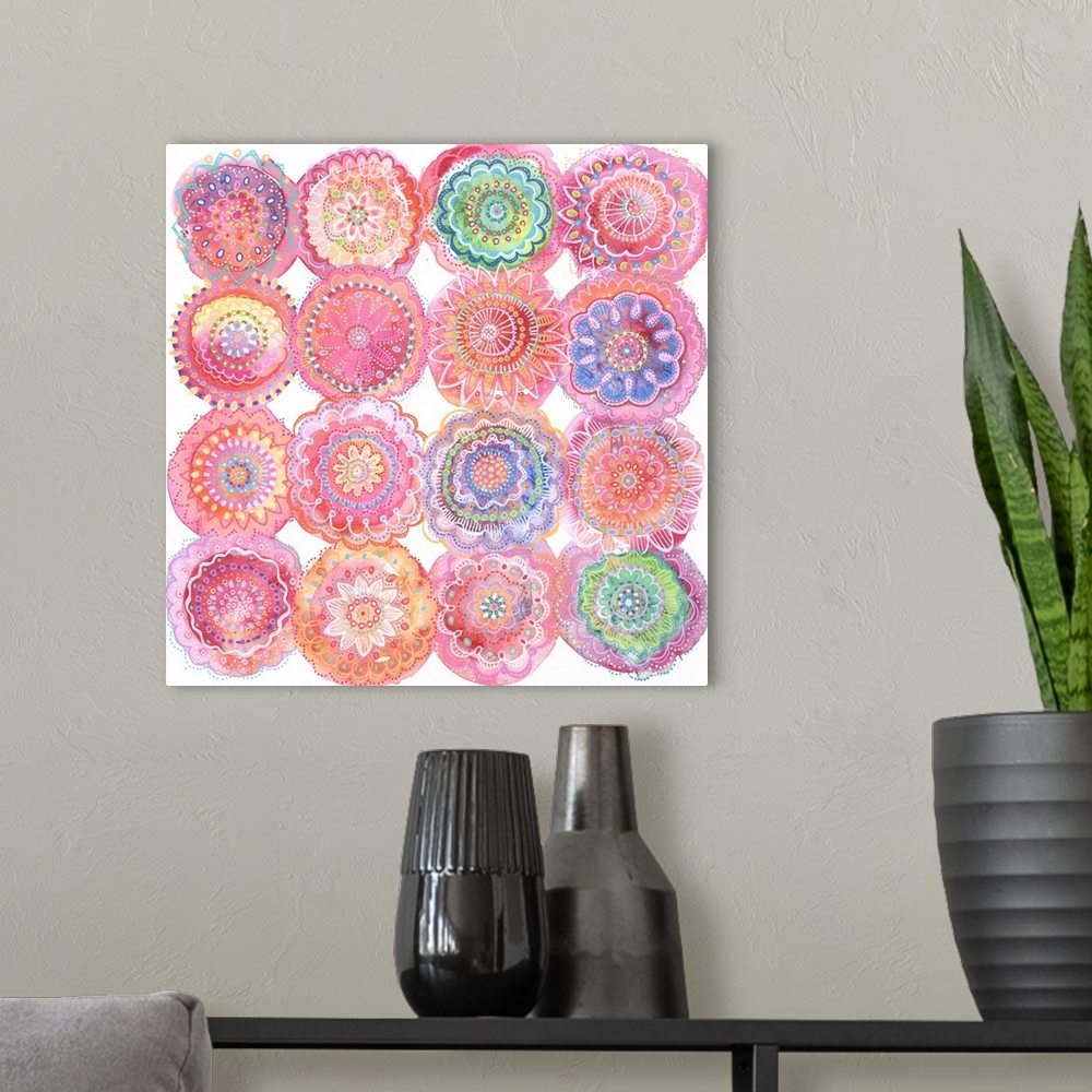 A modern room featuring Abstract Mixed Media of floral inspired mandalas. Detailed line work on pink watercolor bursts.