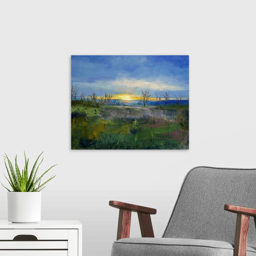 A modern room featuring Oil Painting of the sun's last rays of light on the horizon with bare trees and a grassy field in...