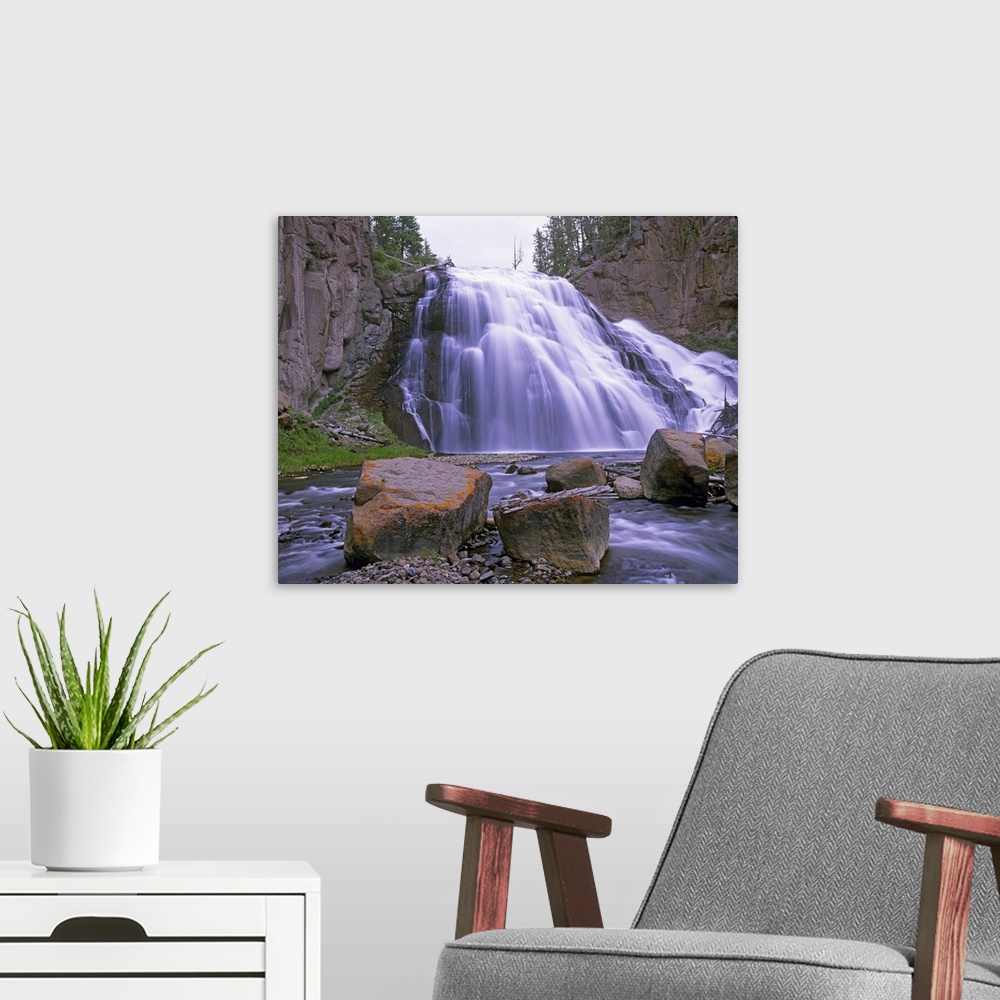 A modern room featuring Gibbon Falls cascading into river, Yellowstone National Park, Wyoming