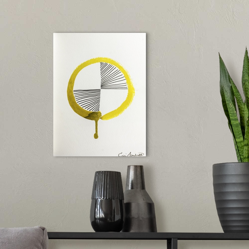 A modern room featuring A golden yellow Enso, or circle, with a drip has black lines radiating out from the center.