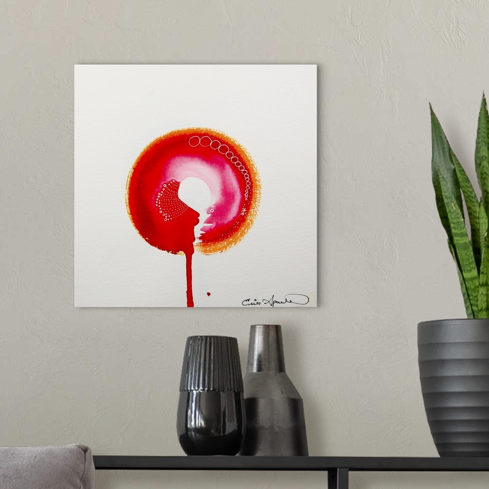 A modern room featuring A bright orange, red and pink enso, or circle hangs suspended on the page. Or is is balanced on t...