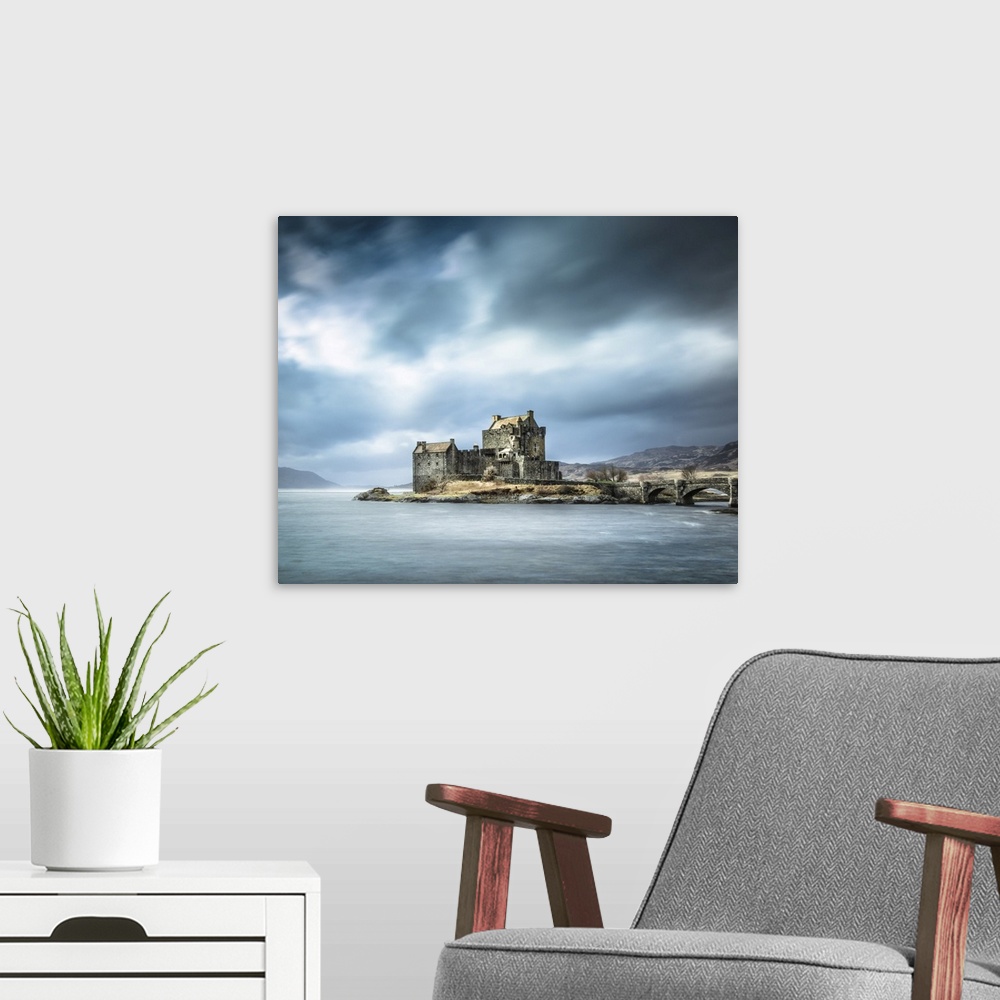 A modern room featuring Beautiful Scottish Castle in the Scottish Highlands called Eilean Donan with a teal sky and drift...