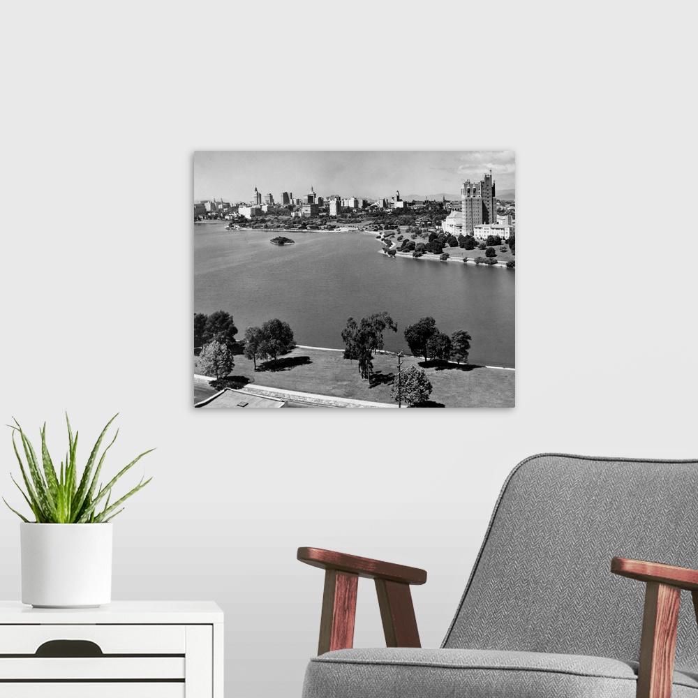 A modern room featuring 1950's With Lake Merritt In Foreground Skyline View Of Oakland California USA.