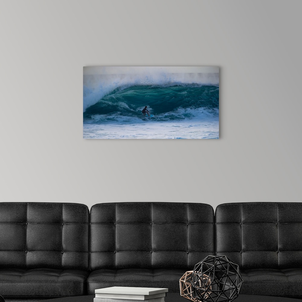 A modern room featuring Man surfing down a wave on beach, Hawaii, USA