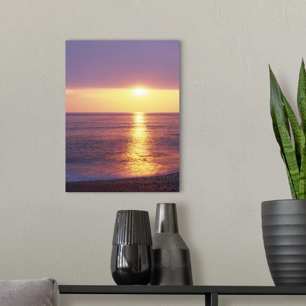 A modern room featuring Sunset over the sea
