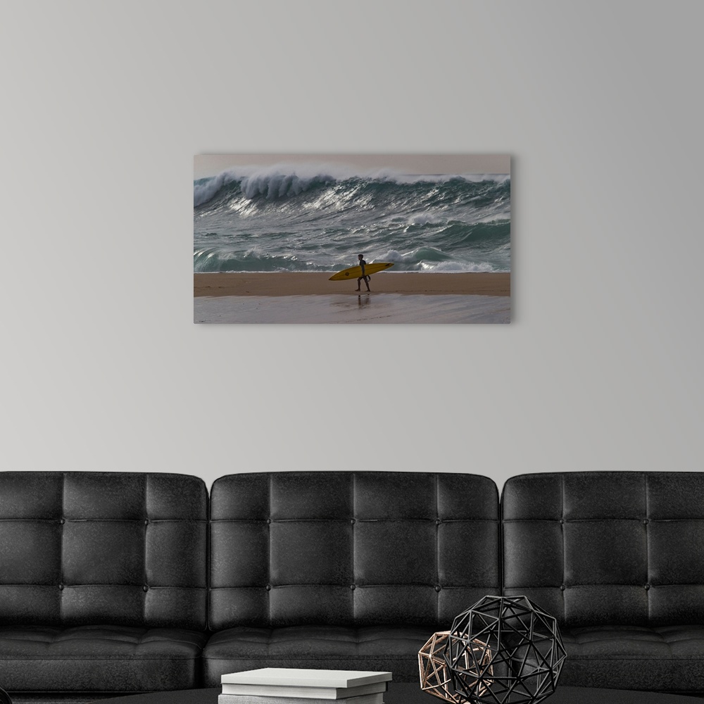 A modern room featuring Surfer walking on the beach, Hawaii, USA