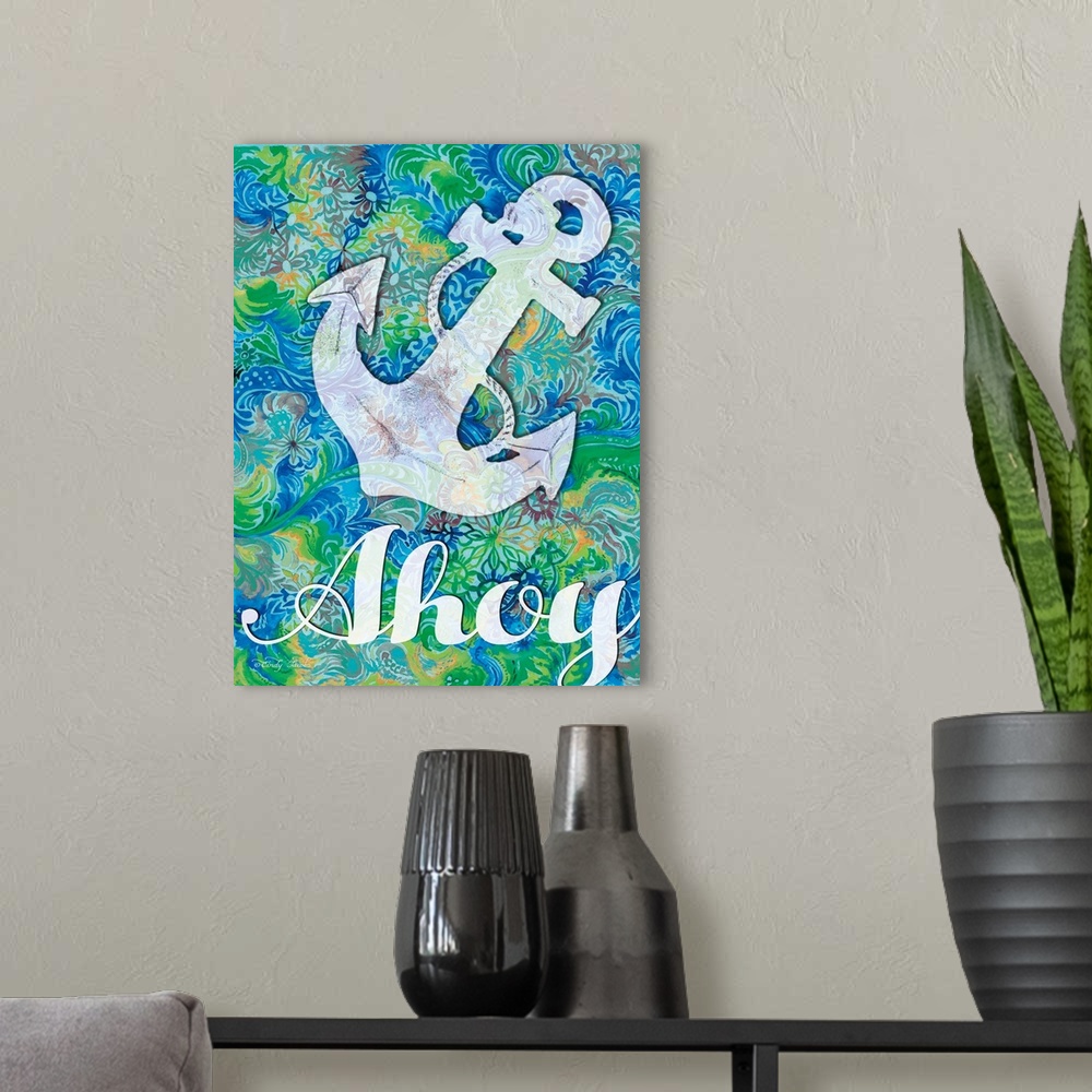 A modern room featuring Nautical themed decor artwork of an anchor and the word "Ahoy" on a blue and green patterned back...