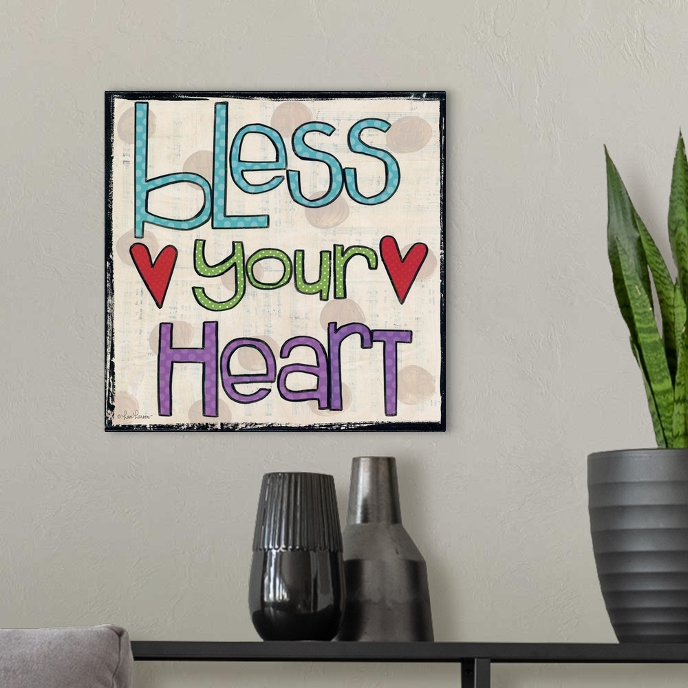 A modern room featuring Handwritten typography art reading "bless your heart" with two red hearts.