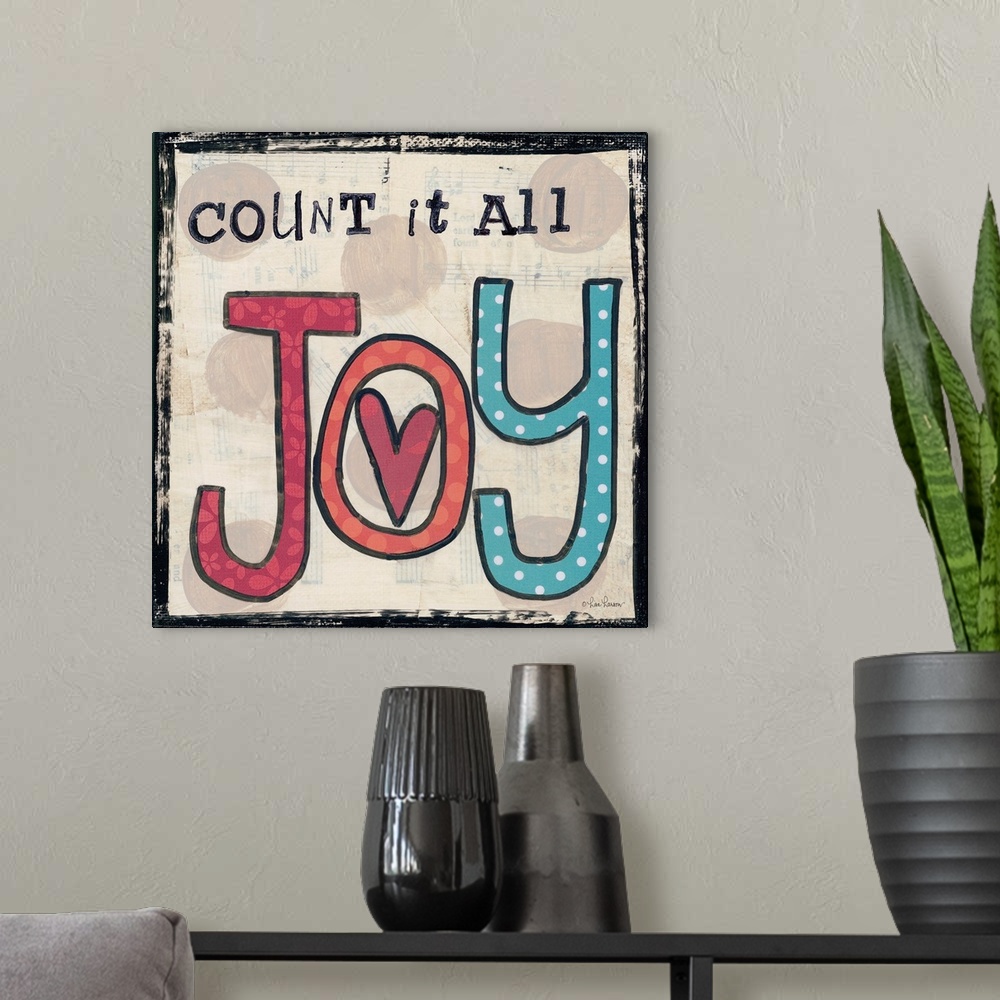 A modern room featuring Handwritten typography art reading "Count it all Joy," with a heart in the center.
