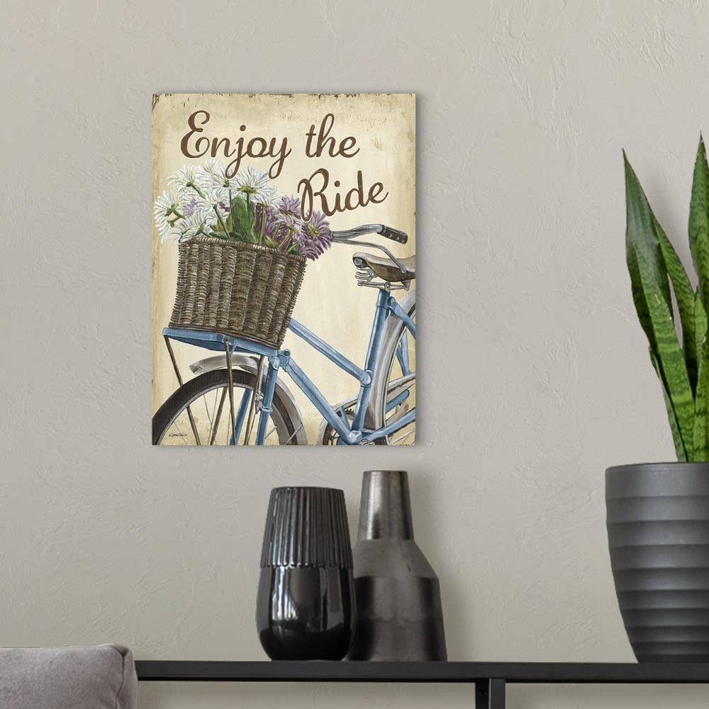 A modern room featuring Illustration of a blue bicycle with a basket full of flowers and the text "Enjoy the Ride."