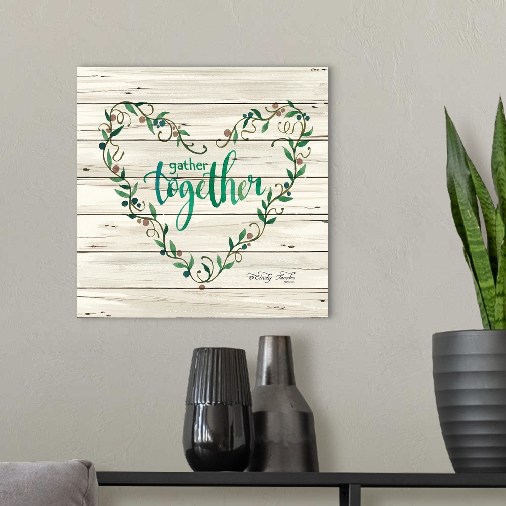 A modern room featuring Decorative artwork featuring these words over white shiplap: Gather together.