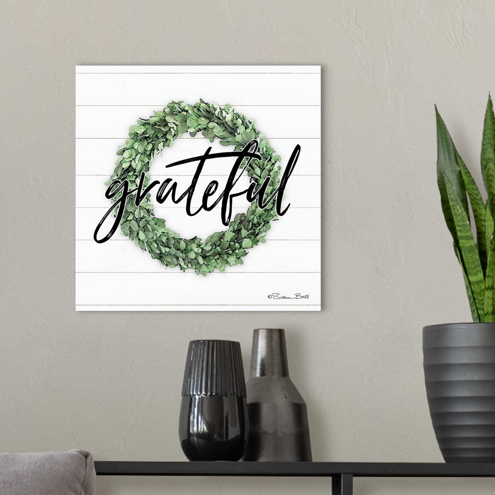 A modern room featuring Grateful Boxwood Wreath