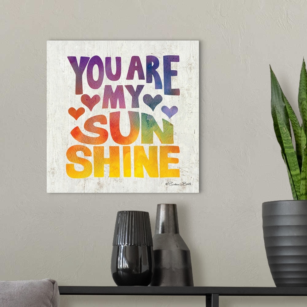 A modern room featuring Sweet, loving sentiment in bold lettering in rainbow watercolors.