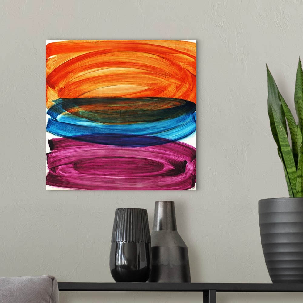 A modern room featuring Abstract painting of three large oval shapes that are vertically stacked, each in a different col...