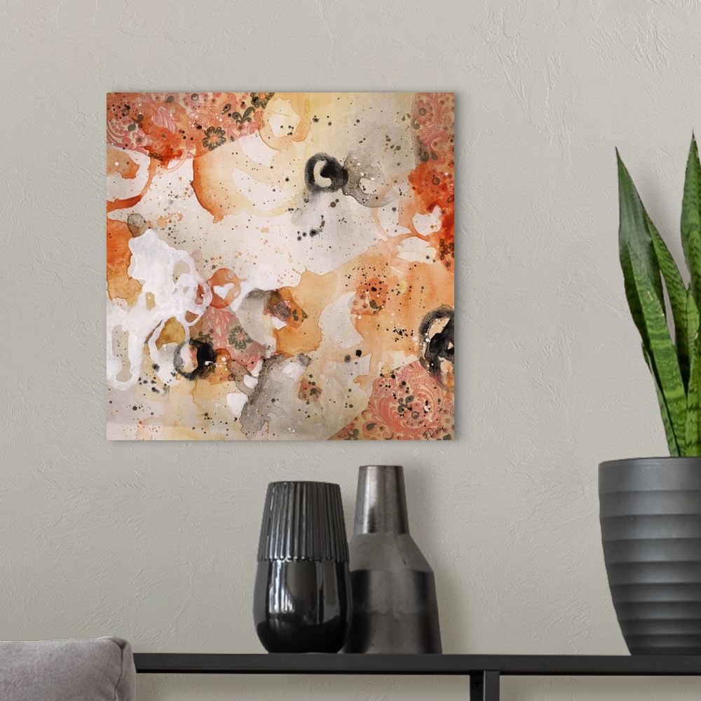 A modern room featuring Abstract painting using bright orange tones in splashes and splatters, almost looking like flowers.
