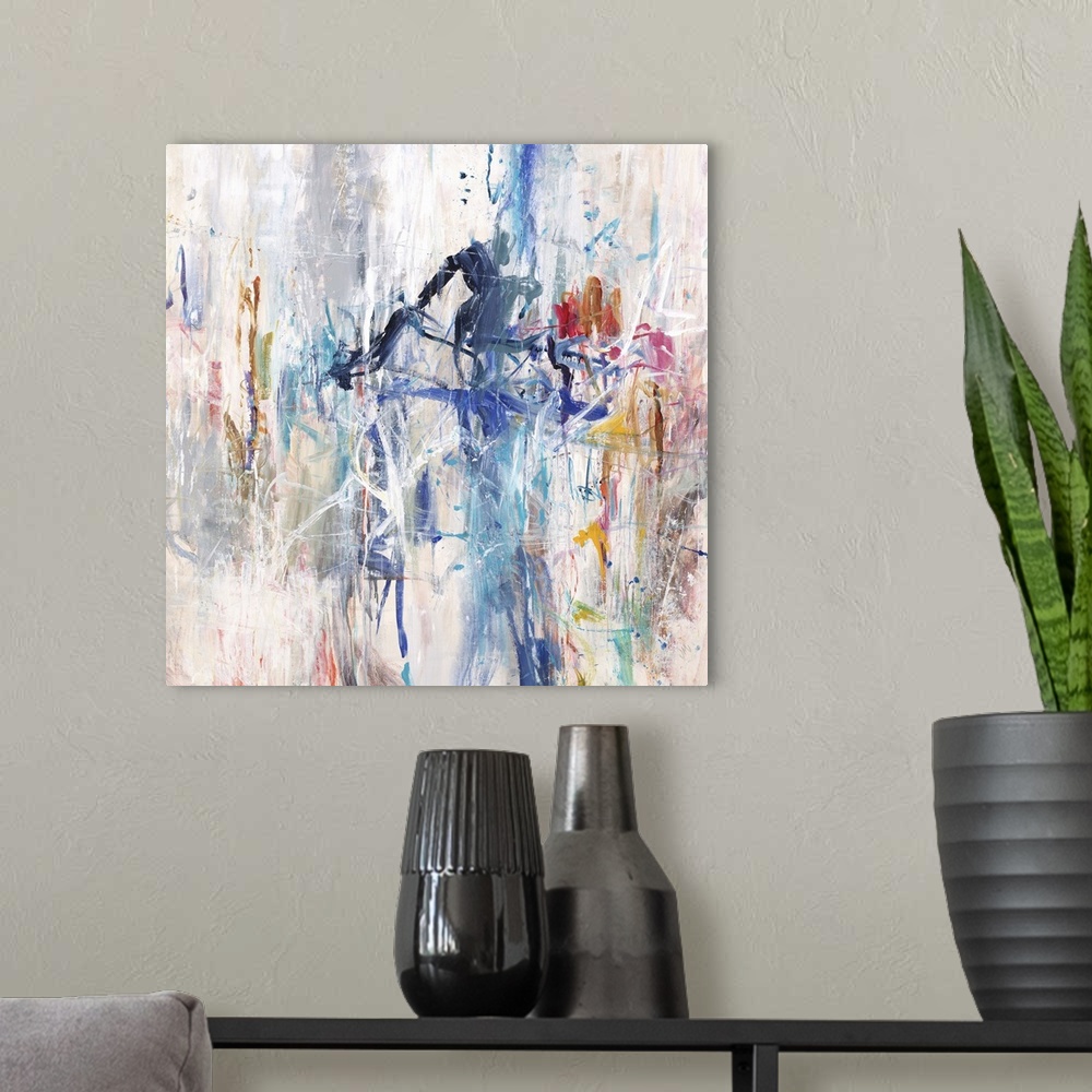 A modern room featuring A contemporary abstract painting using a spectrum of colors in an explosive arrangement.