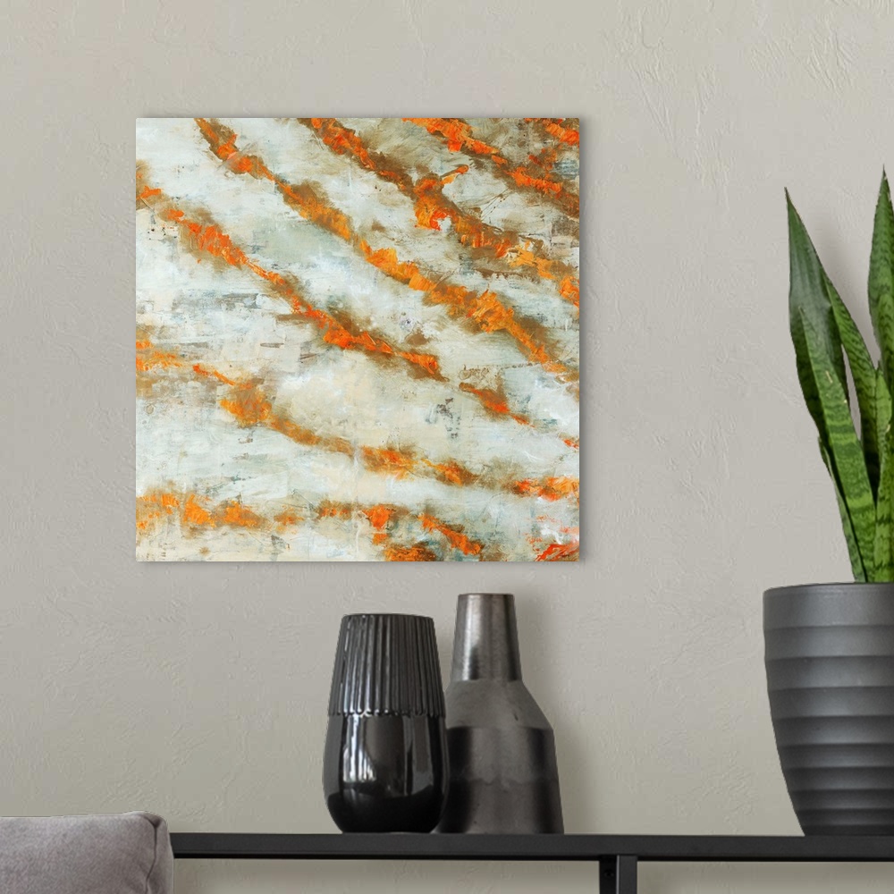 A modern room featuring Abstract painting of numerous diagonal lines in warm tones that are radiating like rays of sunlig...