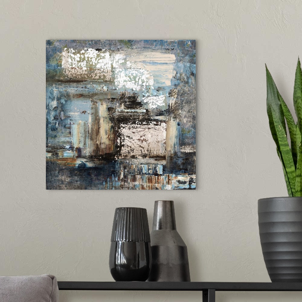 A modern room featuring Contemporary abstract painting of blue and neutral earth tones merging together.