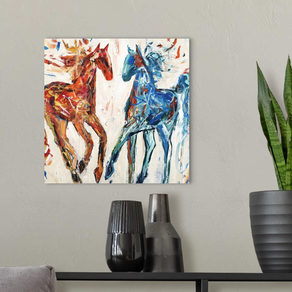 A modern room featuring Contemporary painting of a red and a blue horse.