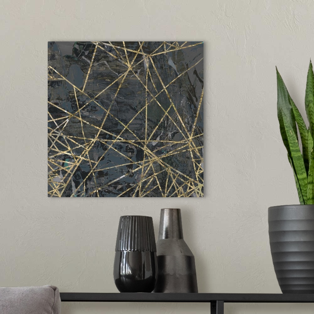 A modern room featuring A square abstract painting of textured gold lines over a dark gray background